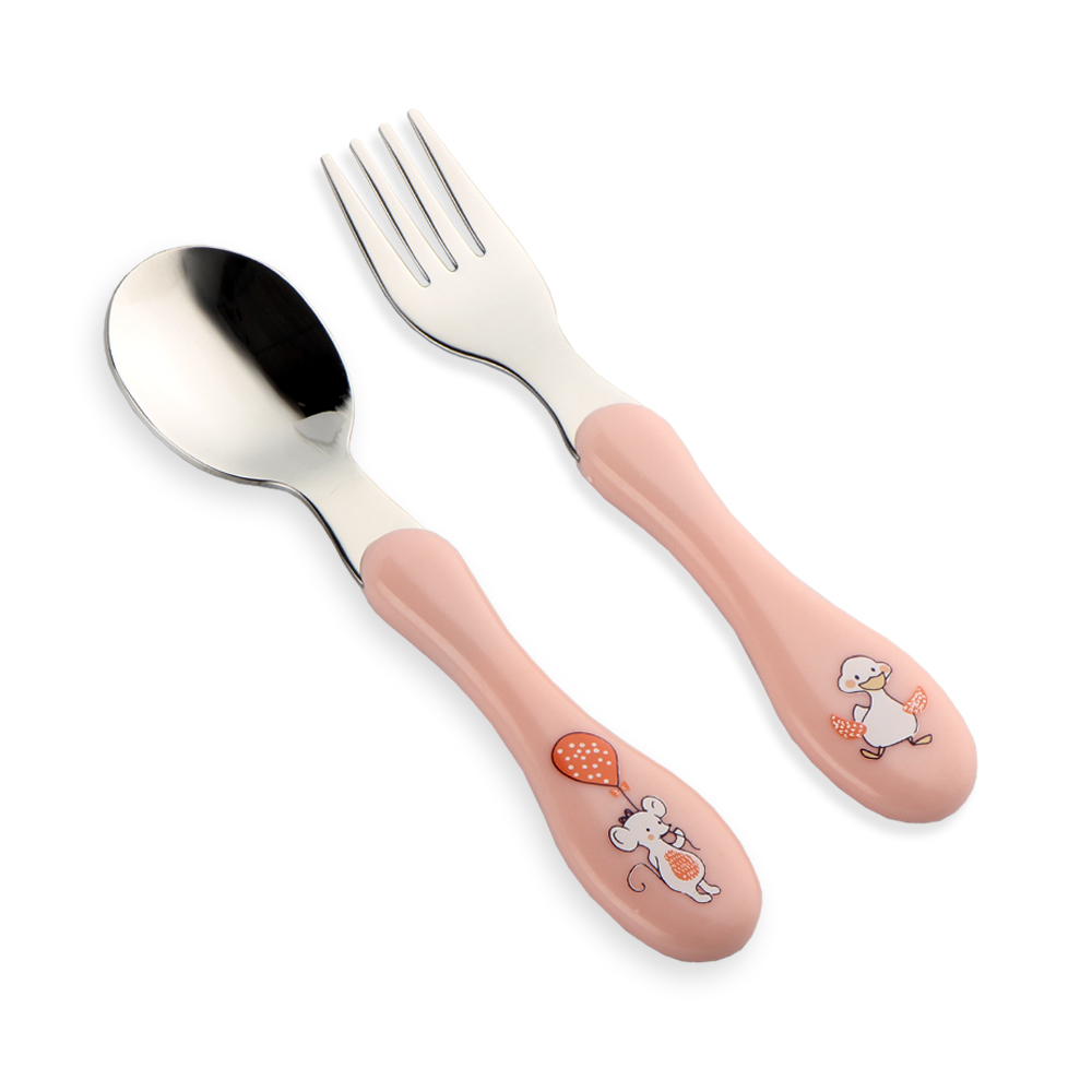 A quality control technician using a sharp point tester on a children's fork