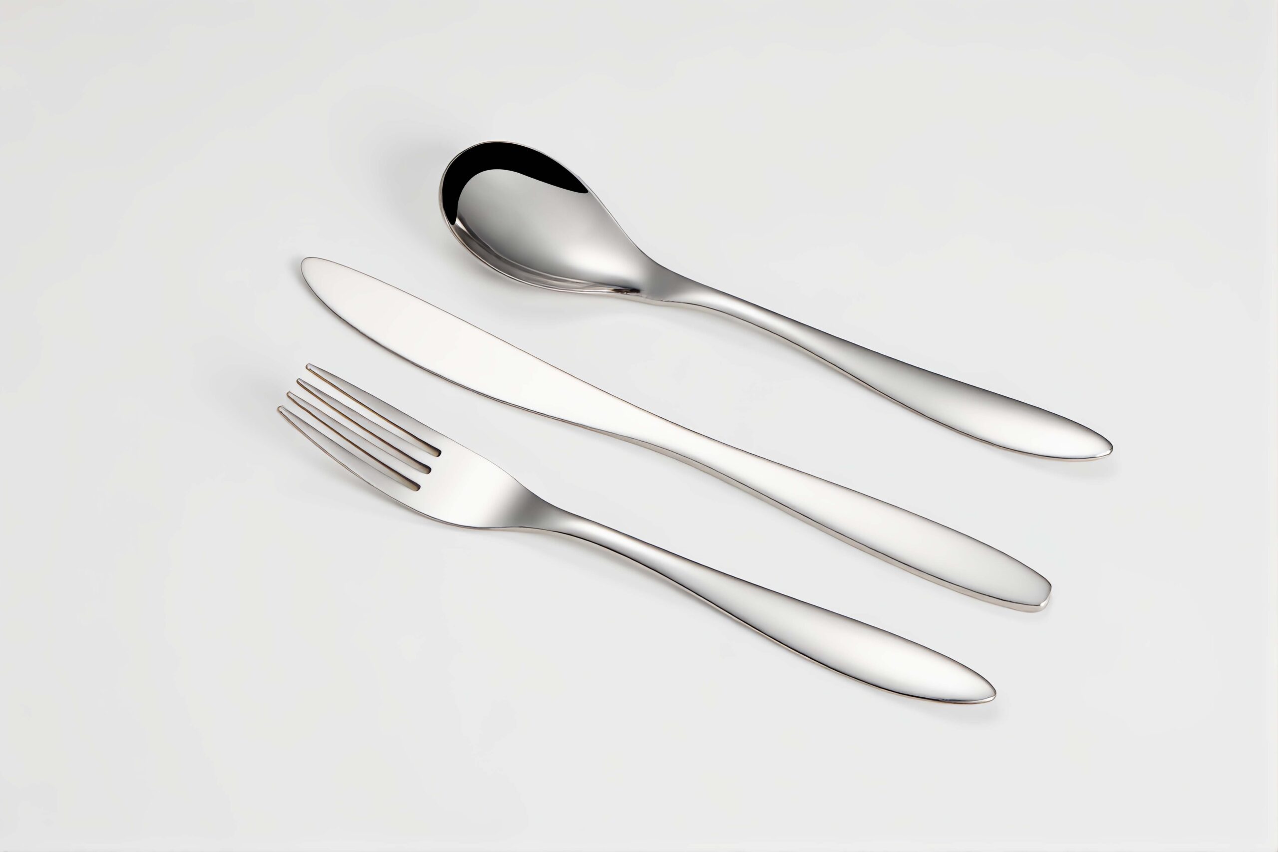 A lightweight, durable airline cutlery set on a tray table