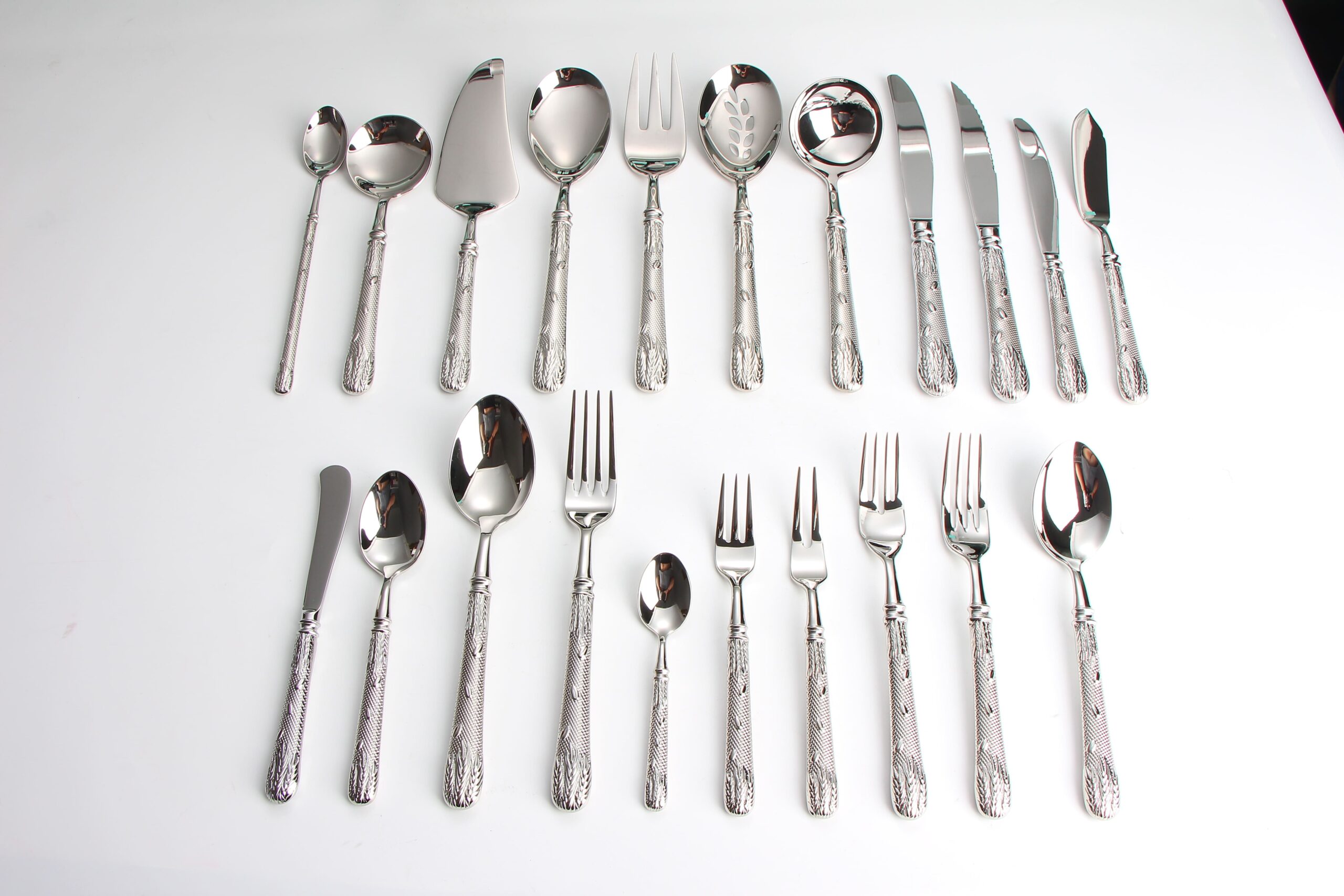 Warehouse shelves stocked with boxes of 18/10 stainless steel cutlery